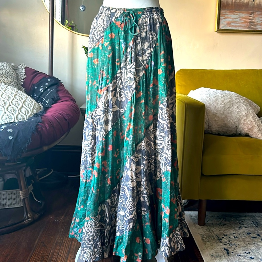 Free people long skirt. Colors green, cream, brown and orange. Size small.